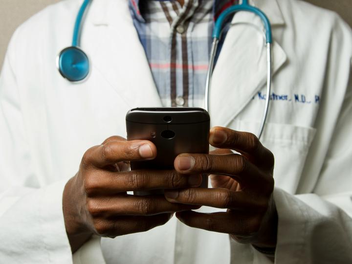 doctor holding a mobile phone