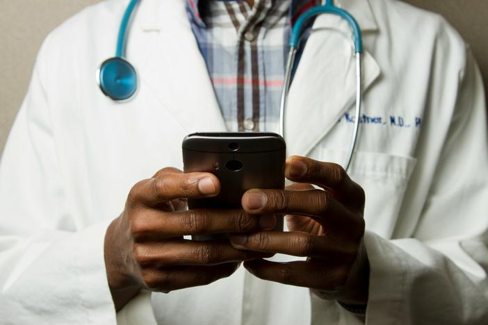 doctor holding a mobile phone